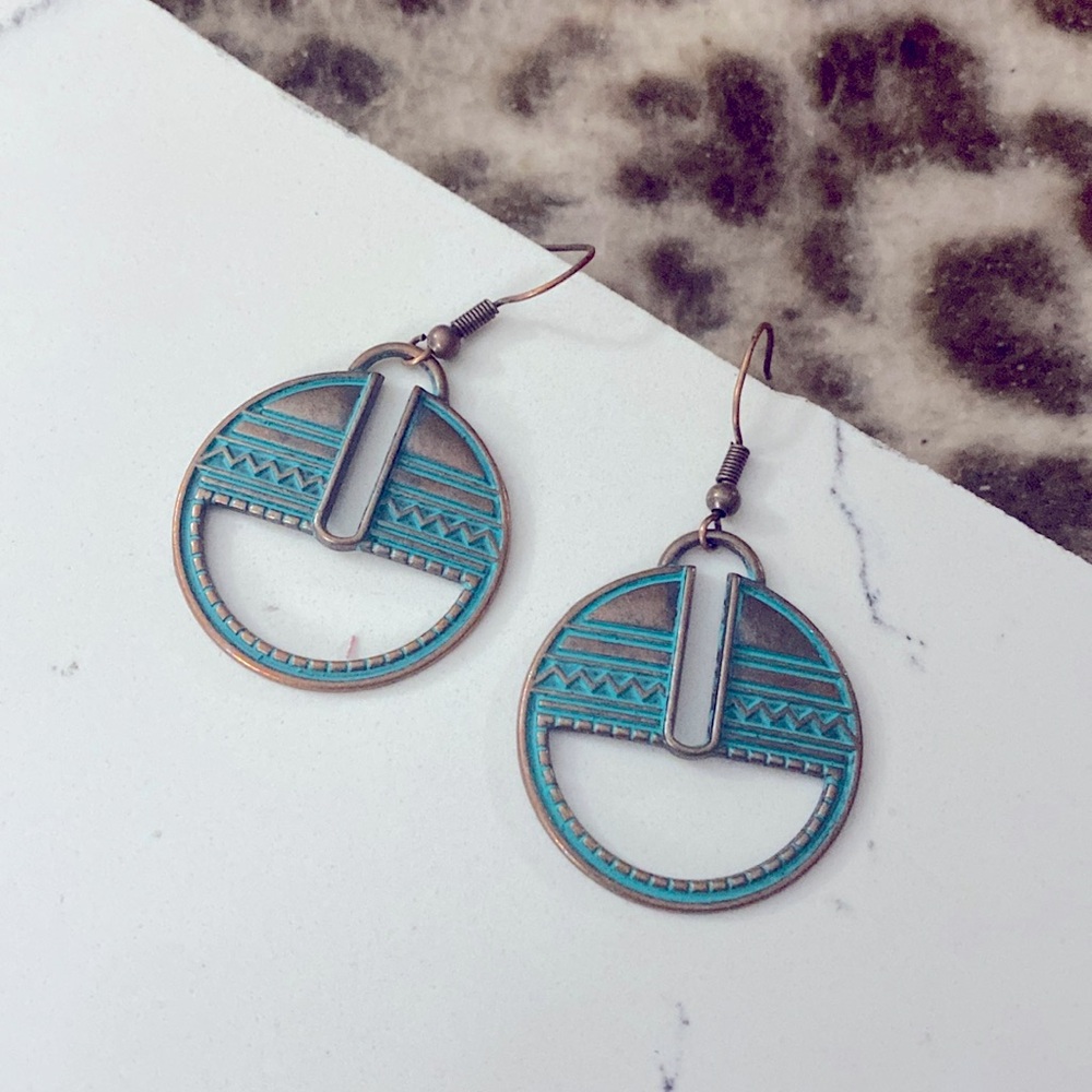 Copper earrings.